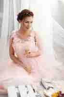 Free photo bride in pink dress