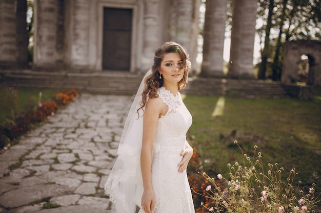 Bride posing with her hand on her belly