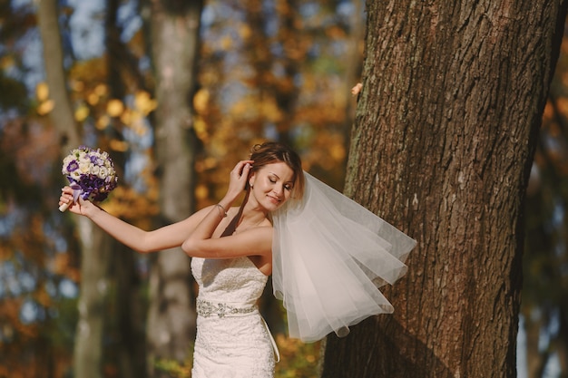 Bride posing with the veil