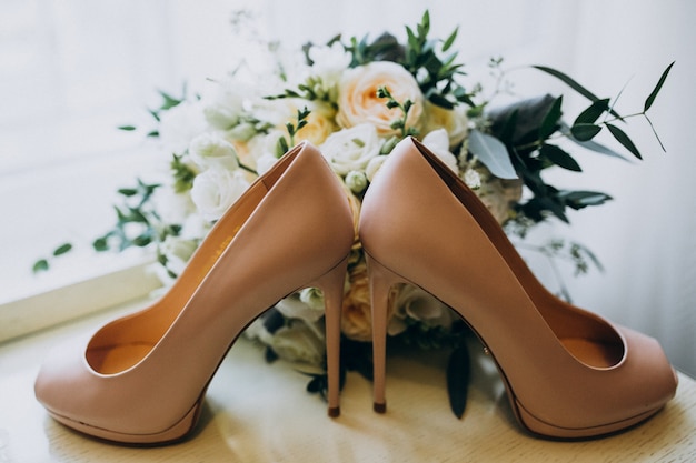 Free photo bride's wedding shoes