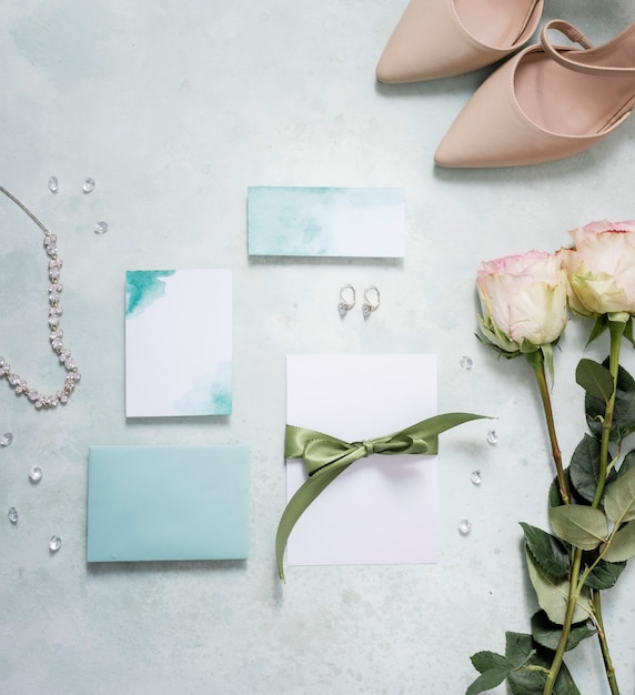 Free photo bride shoes beside wedding card