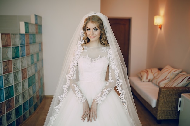 Free photo bride smiling with wedding dress