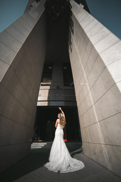 Bride between two large cement columns