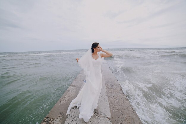 Bride walking on a cement walkway