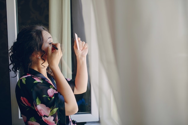 Free photo bride next to the window