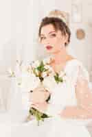 Free photo bride with bouquet of flowers
