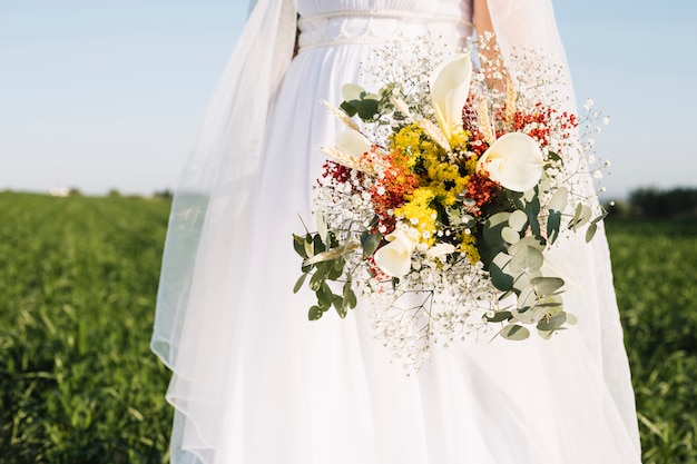 Bride with bouquet of flowers