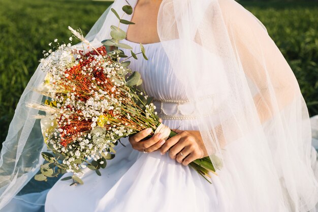 Bride with bouquet of flowers