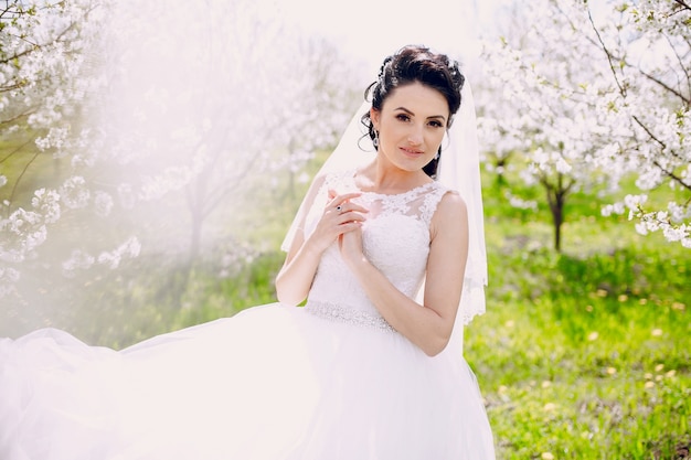 Bride with her wedding dress on a sunny day