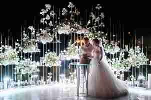 Free photo brides couple cutting wedding cake