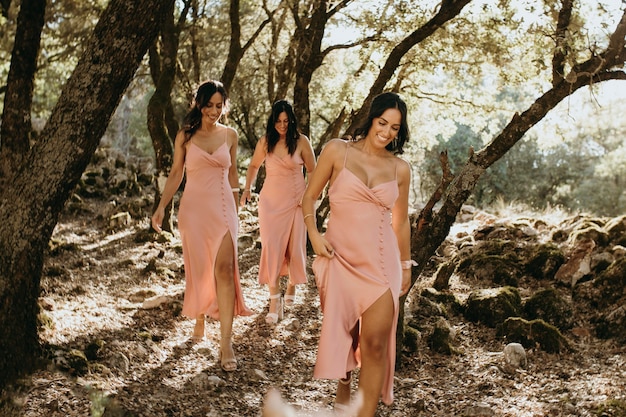 Bridesmaids in pretty dresses celebrating