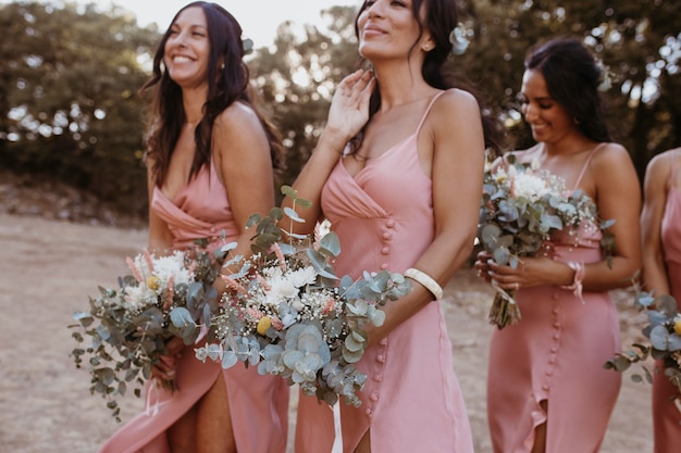 Bridesmaids in pretty dresses outdoors