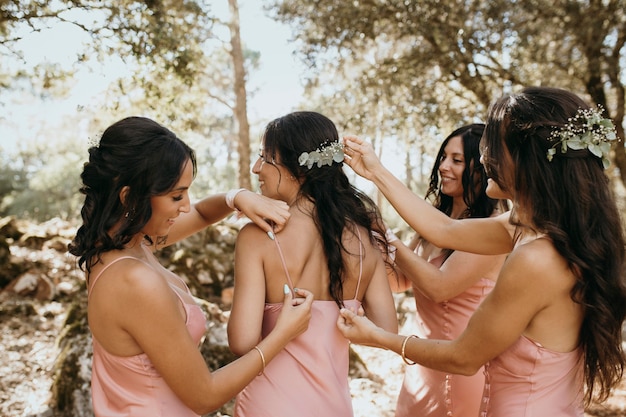 Free photo bridesmaids in pretty dresses outdoors