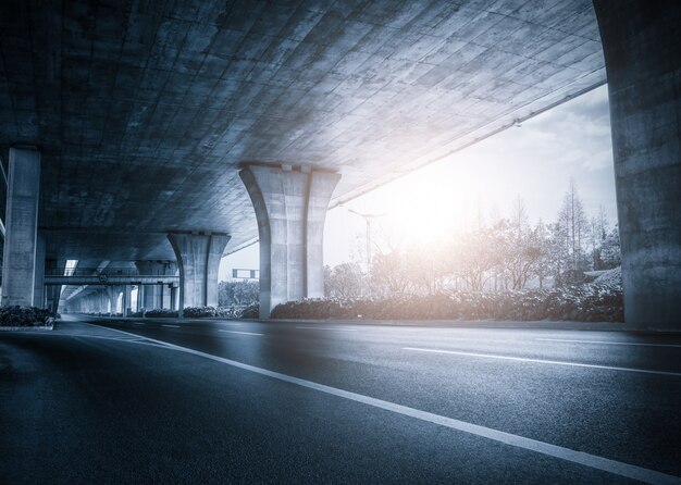 Under a bridge at sunset