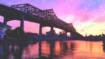 Free photo bridge at sunset