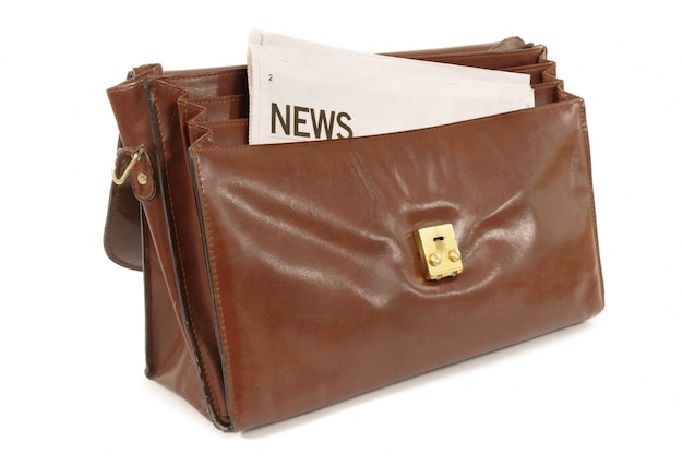 Briefcase with newspaper 