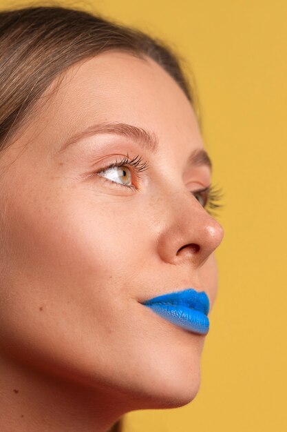 Bright blue lips portrait with copy space