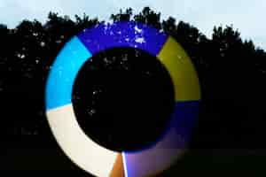 Free photo bright circle light  painting outdoors