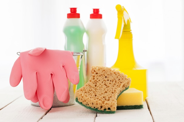 Bright colorful cleaning set on a wooden table