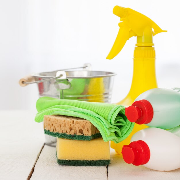 Bright colorful cleaning set on a wooden table