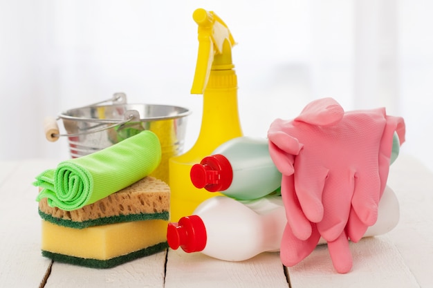 Free photo bright colorful cleaning set on a wooden table