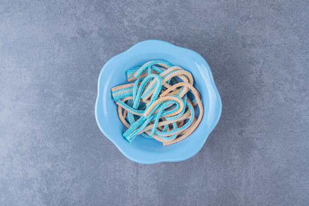 Bright colorful licorice candy in a bowl , on the marble.