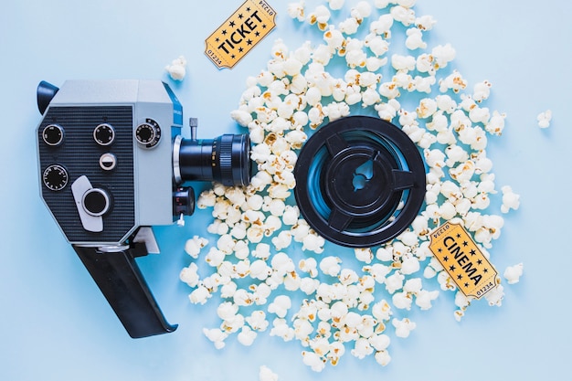 Free photo bright composition of camera and popcorn