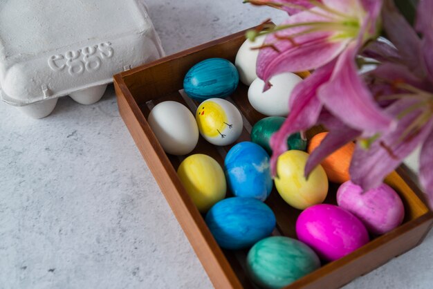 Free photo bright easter eggs on tray