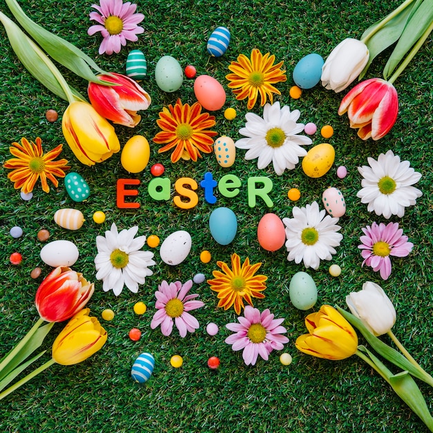 Bright eggs and flowers with word easter