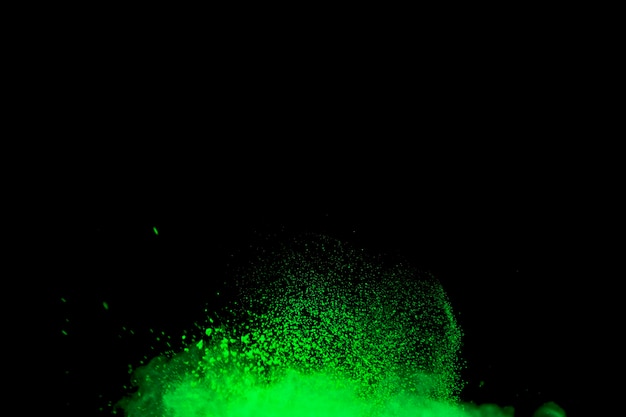 Bright explosion of makeup powder on dark background