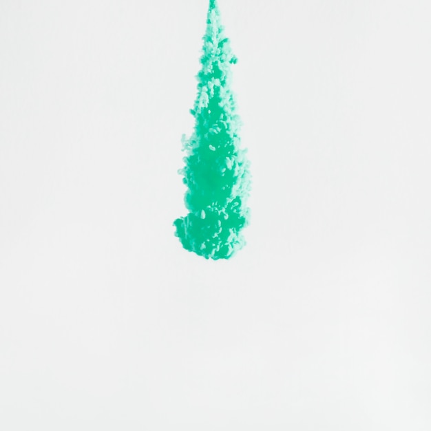 Free photo bright falling drop of ink