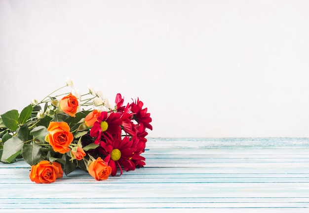 Bright flowers bouquet on table