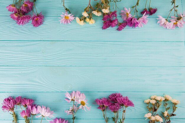 Bright flowers scattered on table