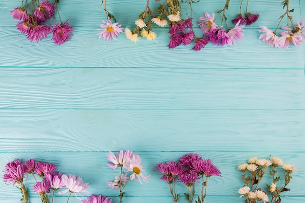 Bright flowers scattered on table