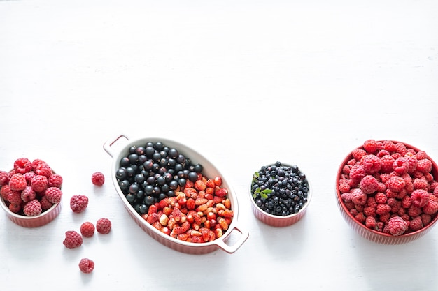 Bright fresh wild berries isolated top view. The concept of healthy eating.