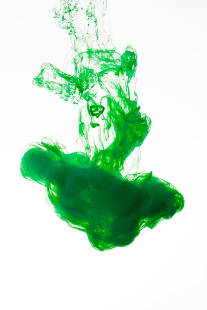 Bright green ink drop falling down