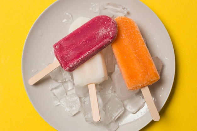 Bright ice lolly on plate