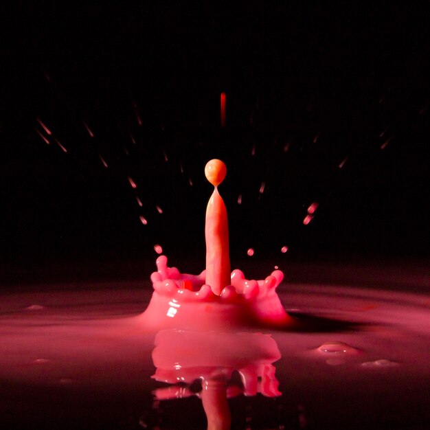 Bright ink drop splashing in water