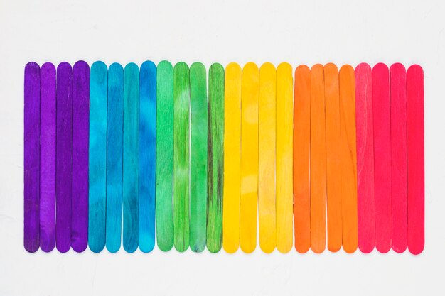 Bright LGBT rainbow of colorful wooden sticks
