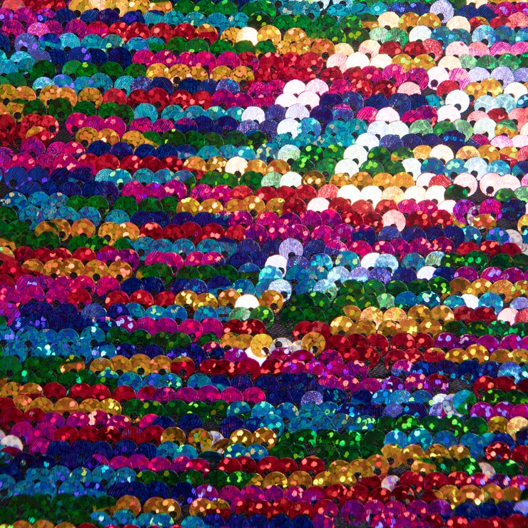 Free Photo bright multicolored sequins in background