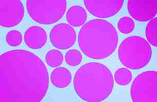 Free photo bright pattern of pink circles on blue background