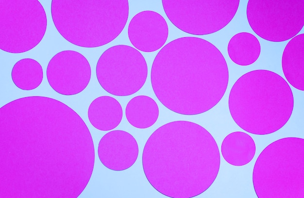 Bright pattern of pink circles on blue background