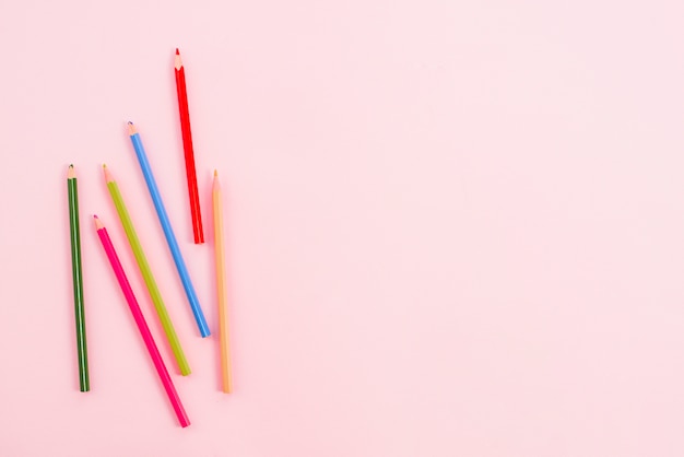 Bright pencils scattered on table