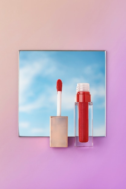 Free photo bright red lip gloss with gradient background