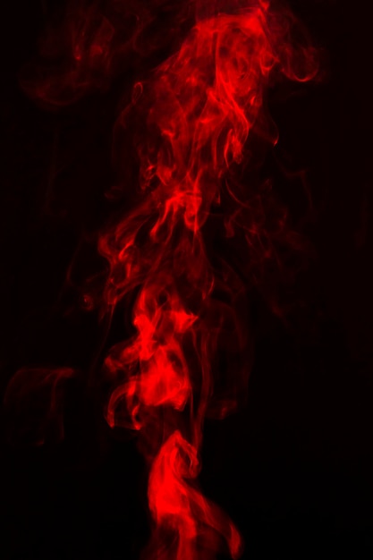 Bright red smoke on dark background