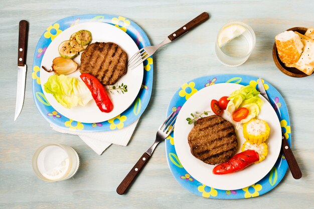 Bright served dinner with steaks and vegetables