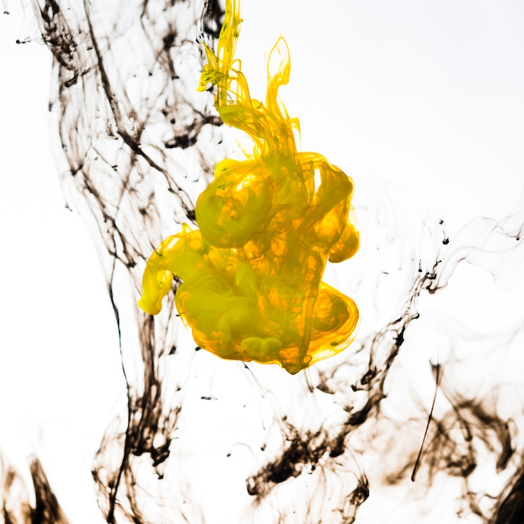 Free Photo bright splashing ink drops underwater