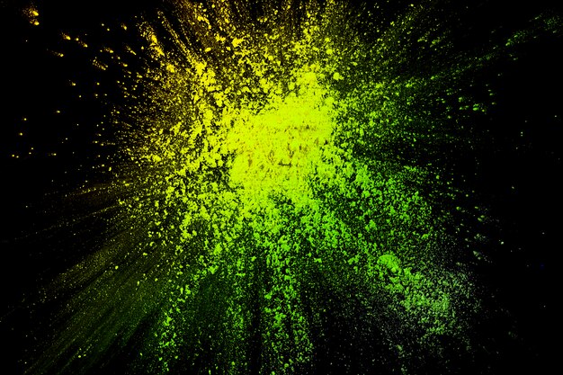 Bright yellow powder holi color splatted backdrop