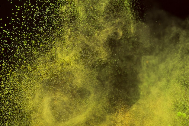 Bright yellow powder in motion 