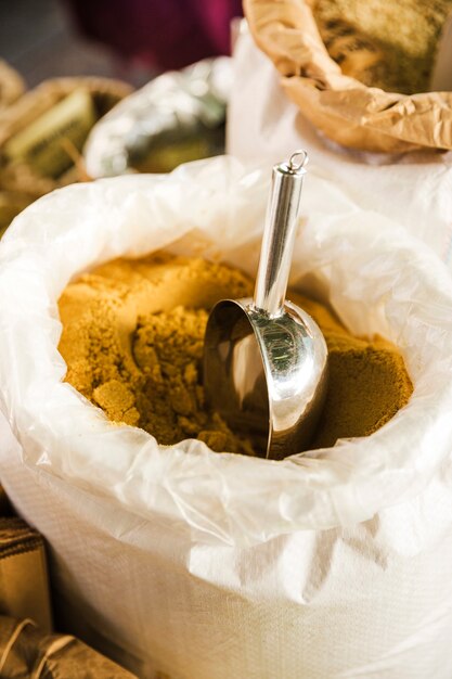 Bright yellow turmeric powder for sale at market